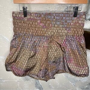 Free People Movement L boxer style athletic shorts all over logo brown pink